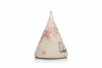 Decorative cone-shaped pillow with cherry blossom and cat design on a white background