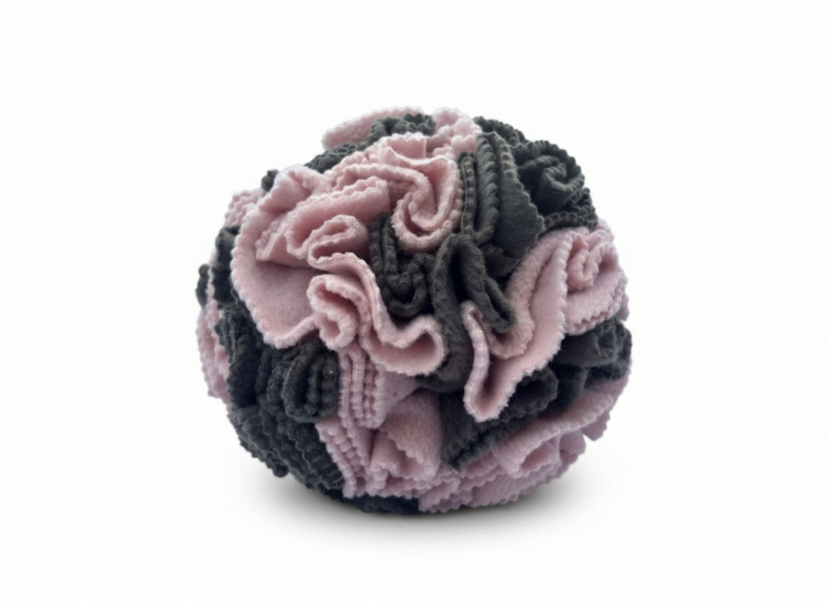 Close-up of Sniffing Ball Dark Pink texture and folds for treat hiding