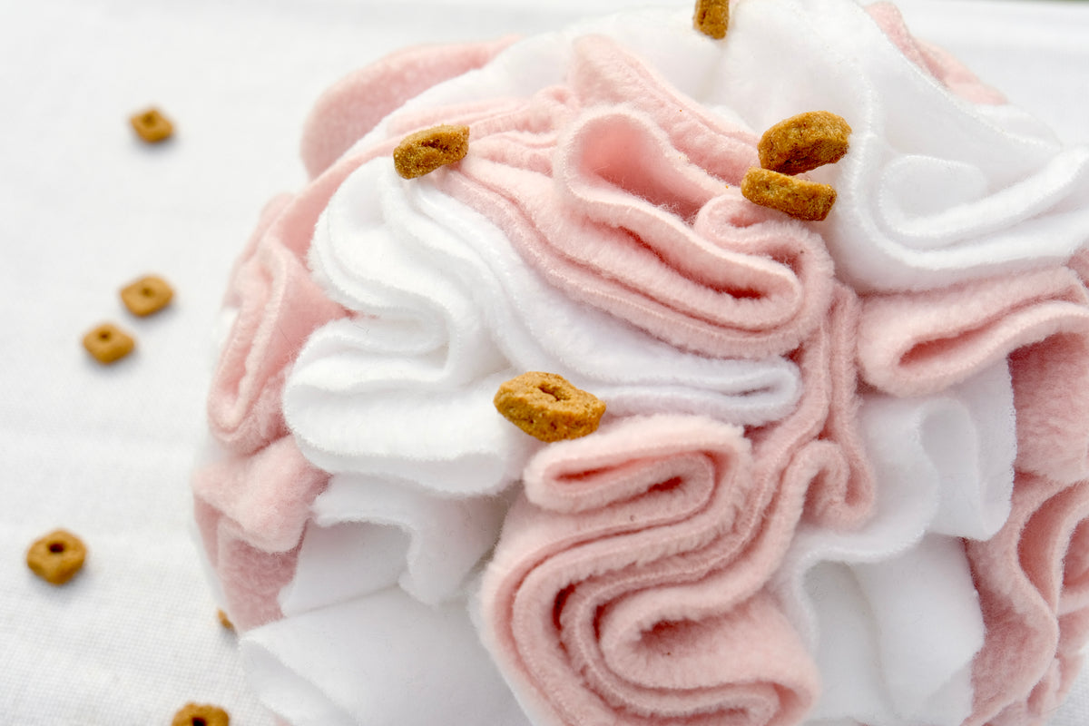 Close-up of Sniffing Ball Light Pink texture and folds for treat hiding